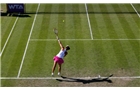 BIRMINGHAM, ENGLAND - JUNE 12:  Casey Dellacquia of Australia serves during Day Four of the Aegon Classic at Edgbaston Priory Club on June 12, 2014 in Birmingham, England.  (Photo by Paul Thomas/Getty Images)